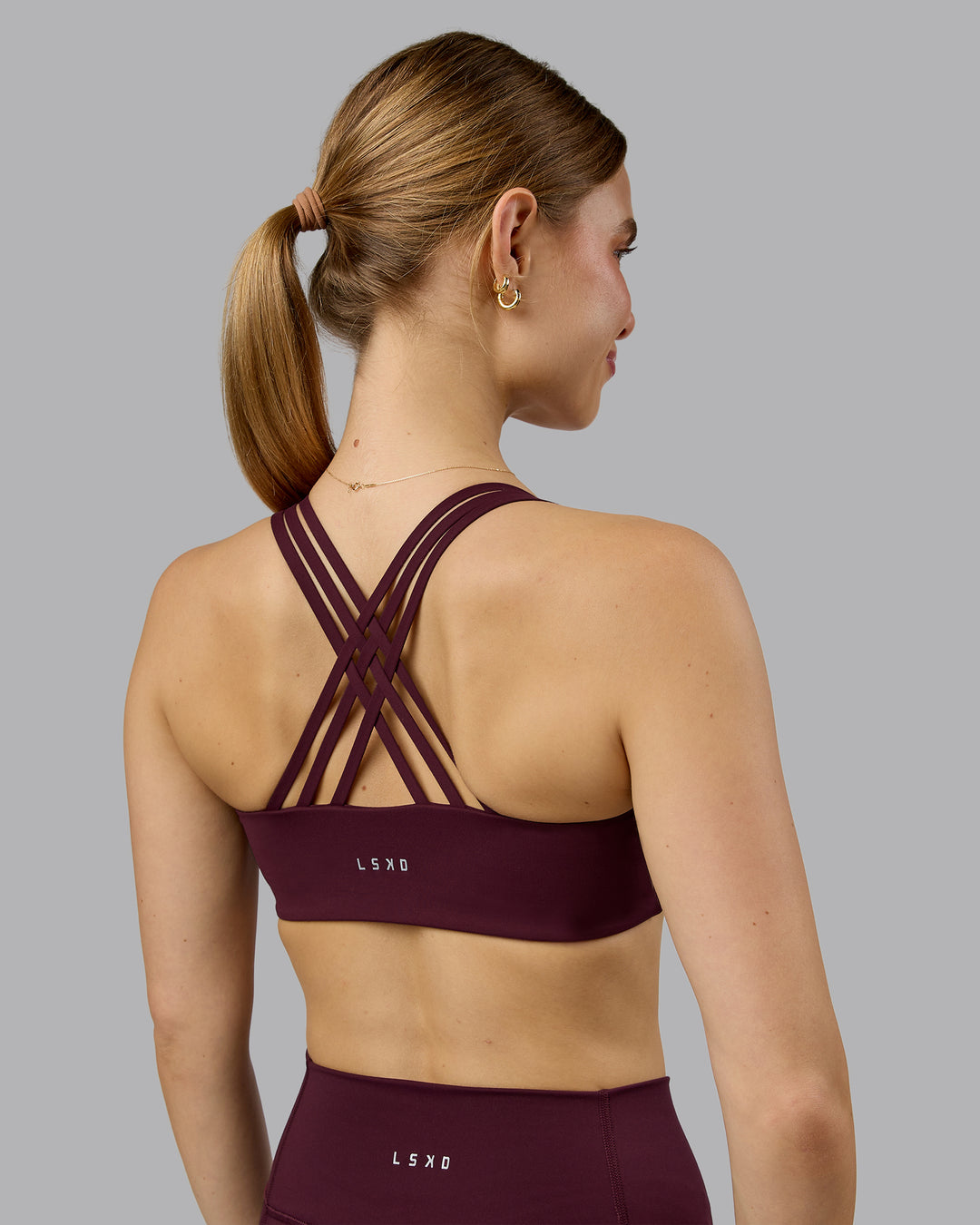 Woman wearing Push The Limit Sports Bra - Cherry Lacquer  Model:Emilie | Size:S - view 4