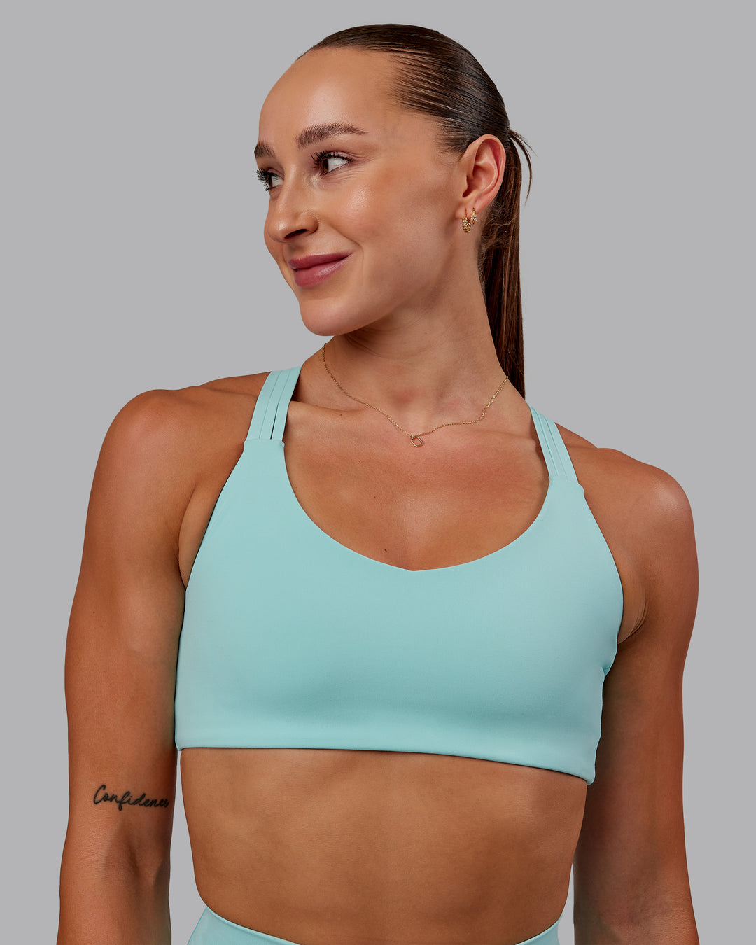 Woman wearing Push The Limit Sports Bra in Island Paradise | Size:S - view 1