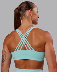 Woman wearing Push The Limit Sports Bra in Island Paradise | Size:S | Thumbnail Index: 5