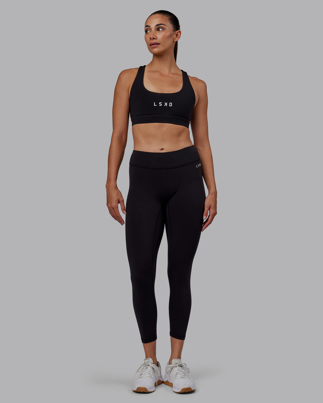 Woman wearing RXD Low-Rise 7/8 Legging - Black | Model:Blaize | Size:S - view 1