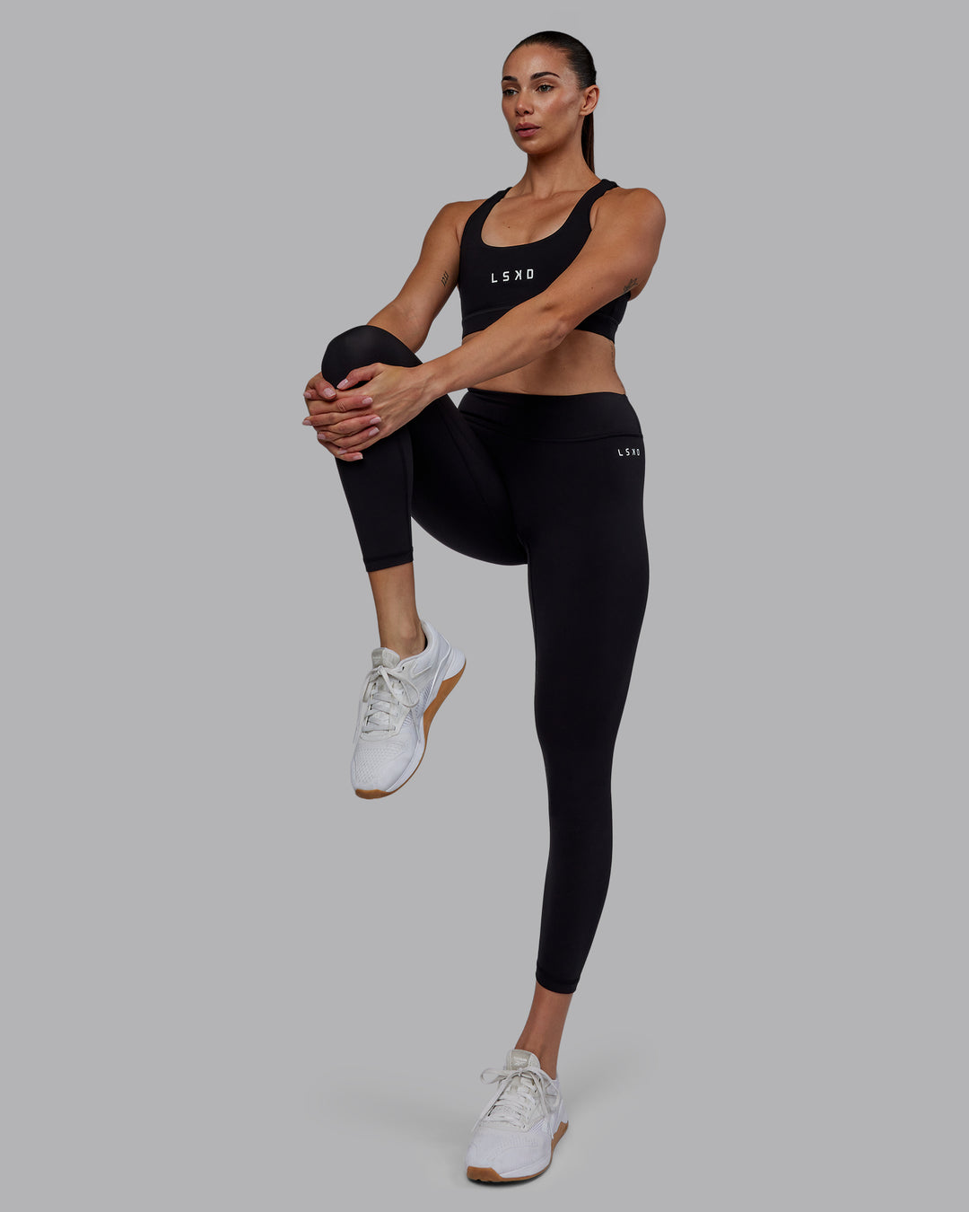 Woman wearing RXD Low-Rise 7/8 Legging - Black | Model:Blaize | Size:S - view 3