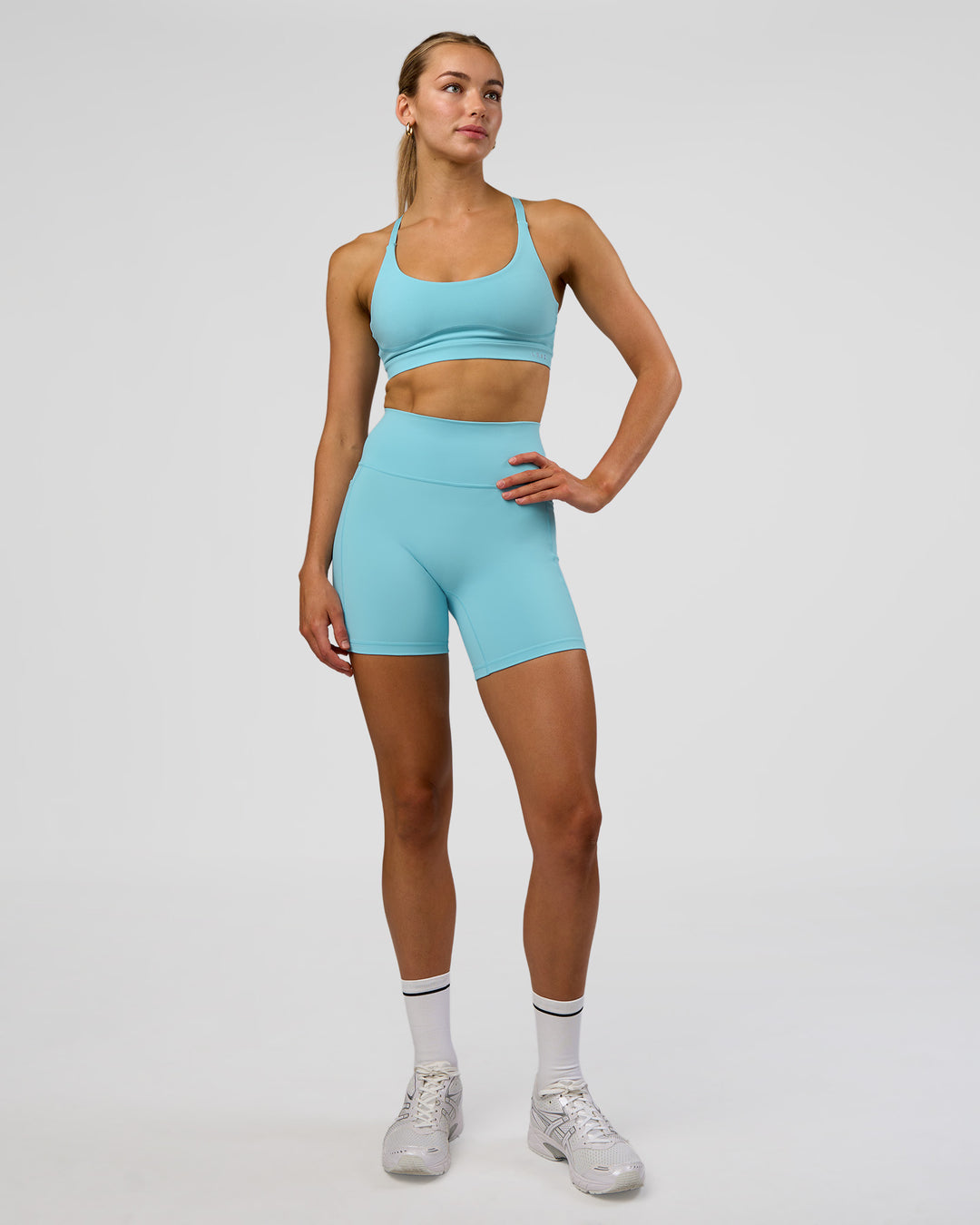 Woman wearing Rapid Sports Bra - Baltic Sea | Model:Evie | Size:S - view 3