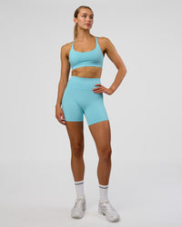 Woman wearing Rapid Sports Bra - Baltic Sea | Model:Evie | Size:S | Thumbnail Index: 2