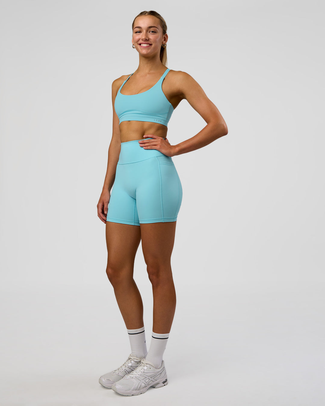 Woman wearing Rapid Sports Bra - Baltic Sea | Model:Evie | Size:S - view 5