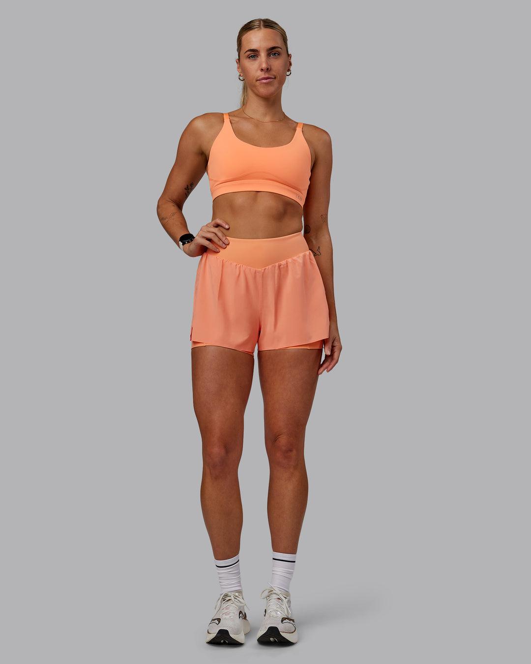 Woman wearing Rapid Sports Bra - Cantaloupe - view 3