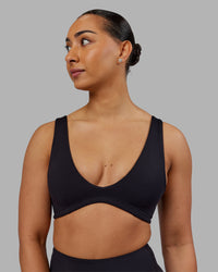 Woman wearing Reform Sports Bra - Black | Model:Ayla | Size:S | Thumbnail Index: 0