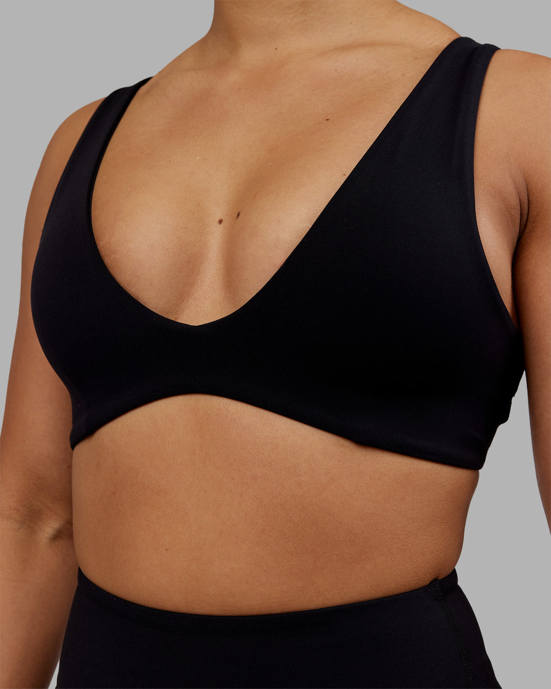 Woman wearing Reform Sports Bra - Black | Model:Ayla | Size:S - view 4