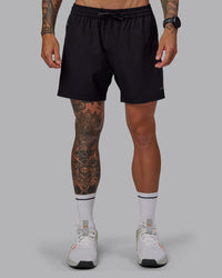 Man wearing Rep 5" Lined Performance Shorts in Black | Size:S | Thumbnail Index: 0