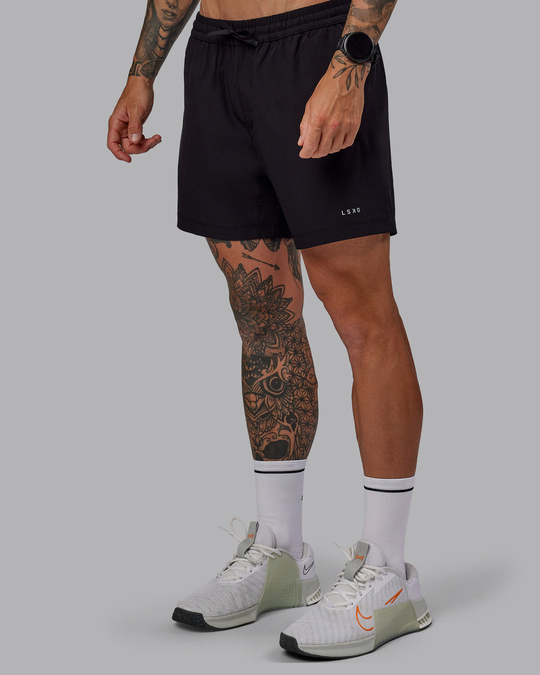 Man wearing Rep 5" Lined Performance Shorts in Black | Size:S - view 6