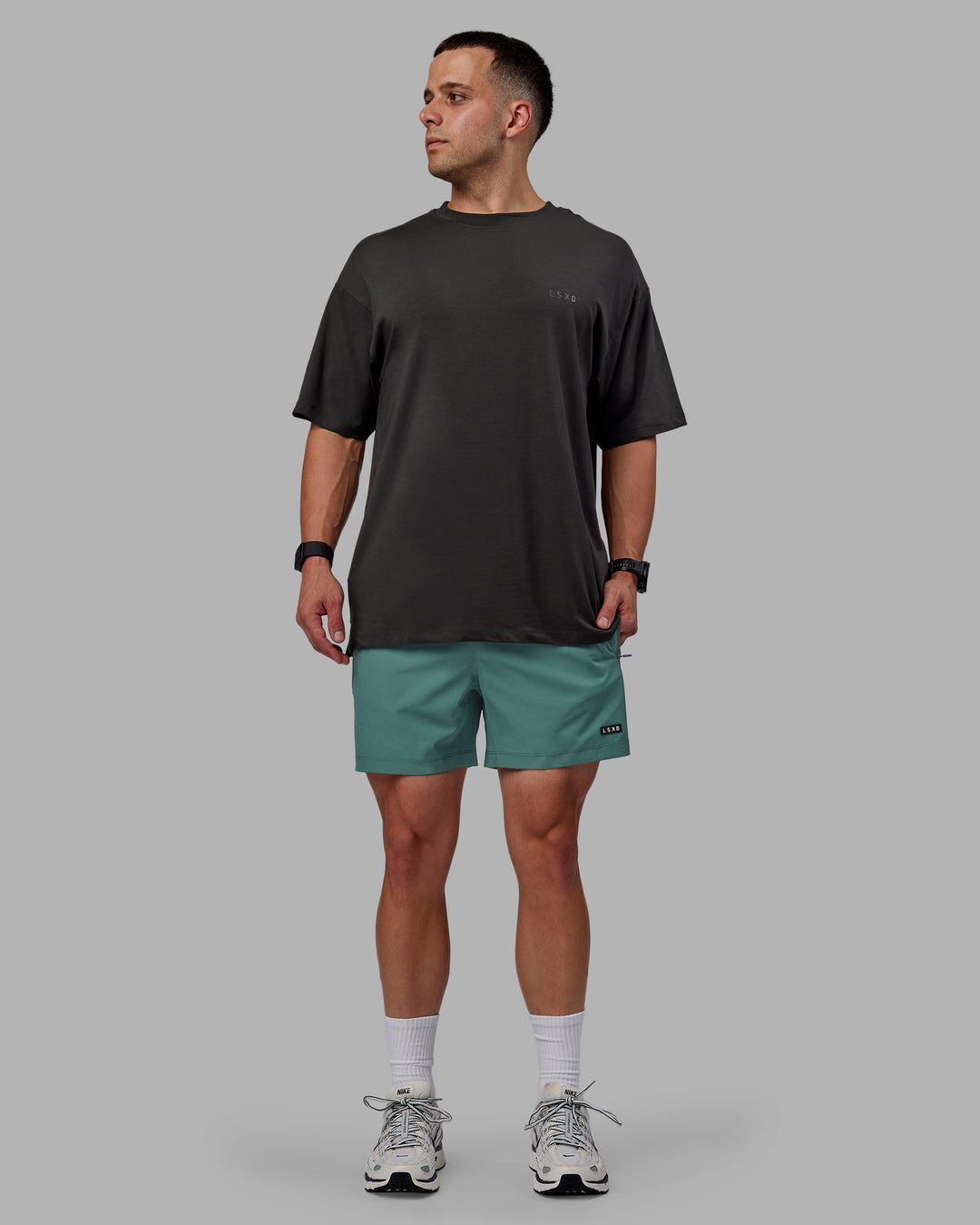 Man wearing Rep 5" Performance Shorts - Sage Bush - view 6