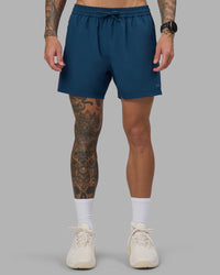 Man wearing Rep 5" Performance Short - Night Sea | Model:Tommy | Size:S | Thumbnail Index: 1