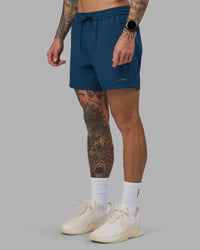Man wearing Rep 5" Performance Short - Night Sea | Model:Tommy | Size:S | Thumbnail Index: 7