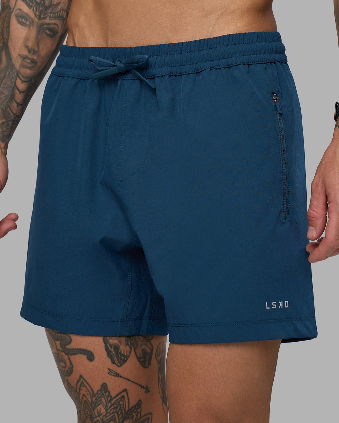 Man wearing Rep 5" Performance Short - Night Sea | Model:Tommy | Size:S - view 1