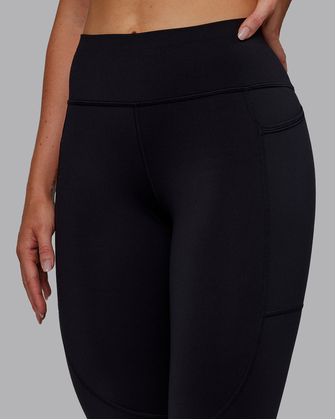 Woman wearing Rep Ultra High-Rise 7/8 Legging Pockets - Black-Retro Blue | Model:Paris | Size:S - view 10