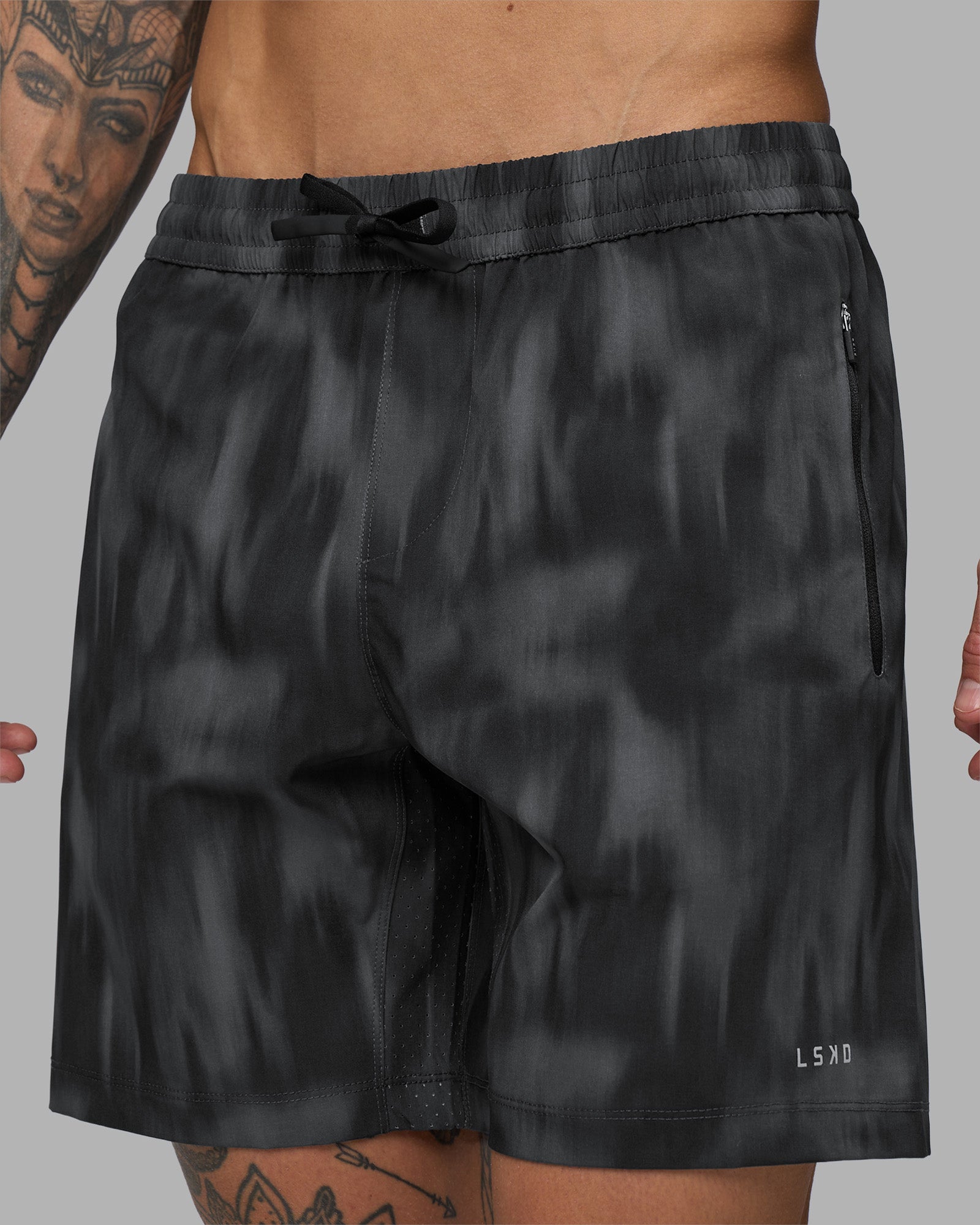 Man wearing Rep 7'' Performance Short - Lunar Glow Print | Model:Tommy | Size:S