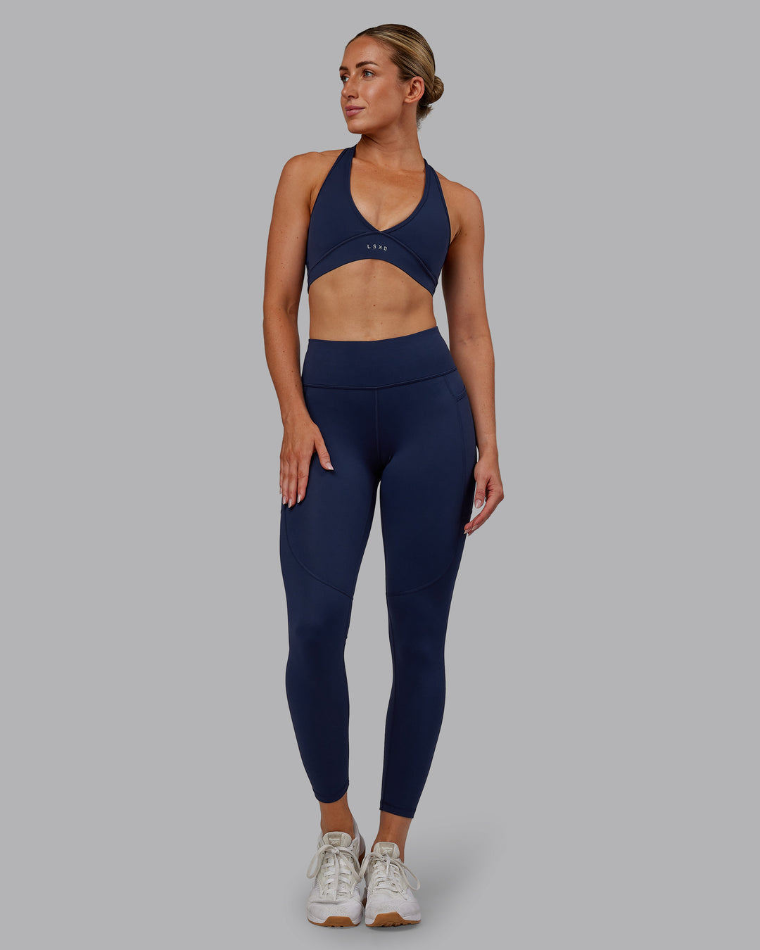 Woman wearing Rep Ultra High-Rise 7/8 Legging Pockets No Logo - Future Navy | Model:Paris | SIze:S - view 3