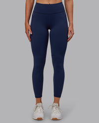 Woman wearing Rep Ultra High-Rise 7/8 Legging Pockets No Logo - Future Navy | Model:Paris | SIze:S | Thumbnail Index: 0