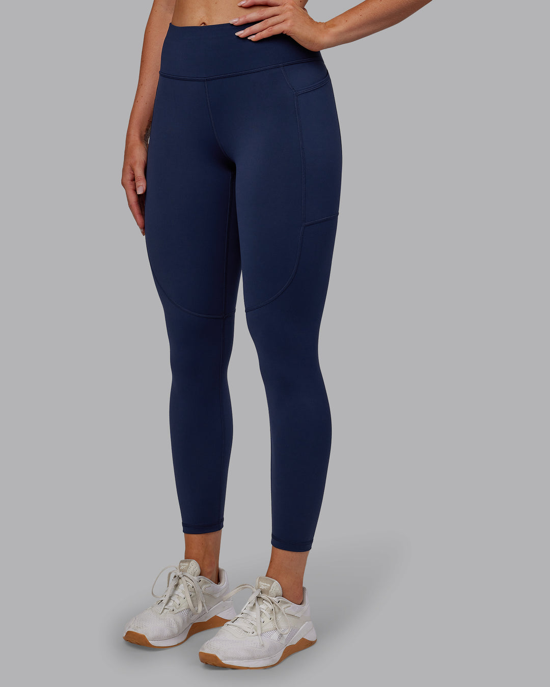 Woman wearing Rep Ultra High-Rise 7/8 Legging Pockets No Logo - Future Navy | Model:Paris | SIze:S - view 5