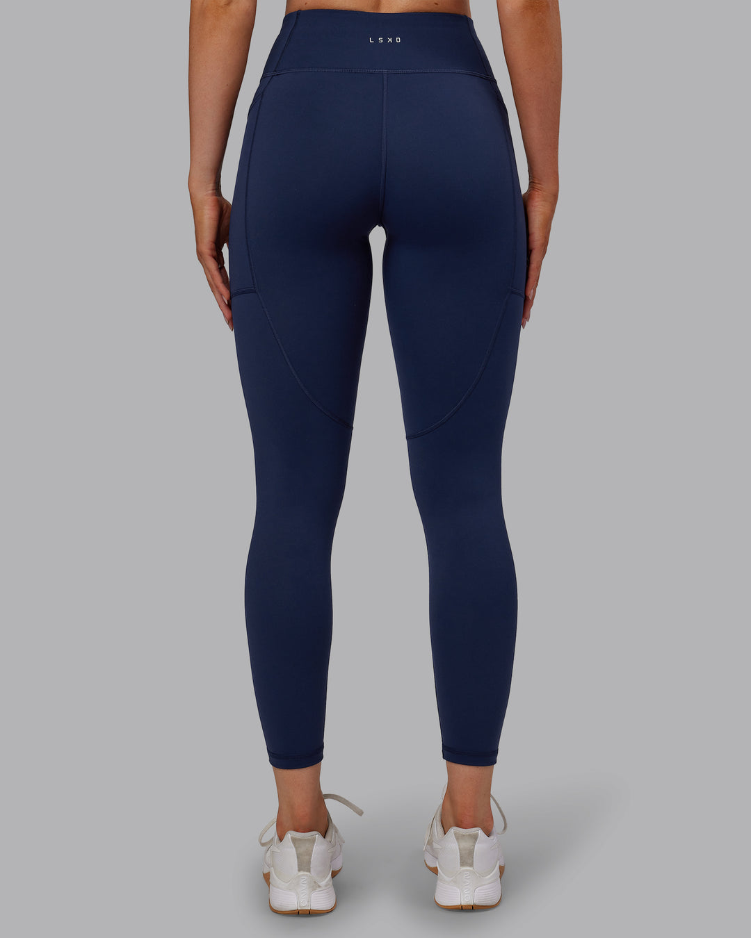 Woman wearing Rep Ultra High-Rise 7/8 Legging Pockets No Logo - Future Navy | Model:Paris | SIze:S - view 4