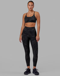 Woman wearing Rep Ultra High-Rise 7/8 Legging Pockets - Black Camo | Model:Milly | Size:S | Thumbnail Index: 2