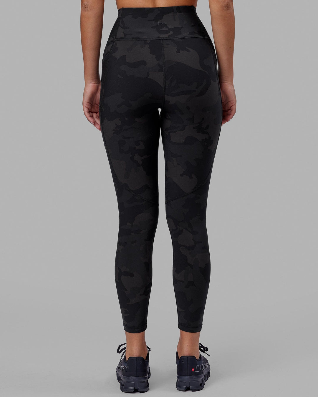 Woman wearing Rep Ultra High-Rise 7/8 Legging Pockets - Black Camo | Model:Milly | Size:S - view 4