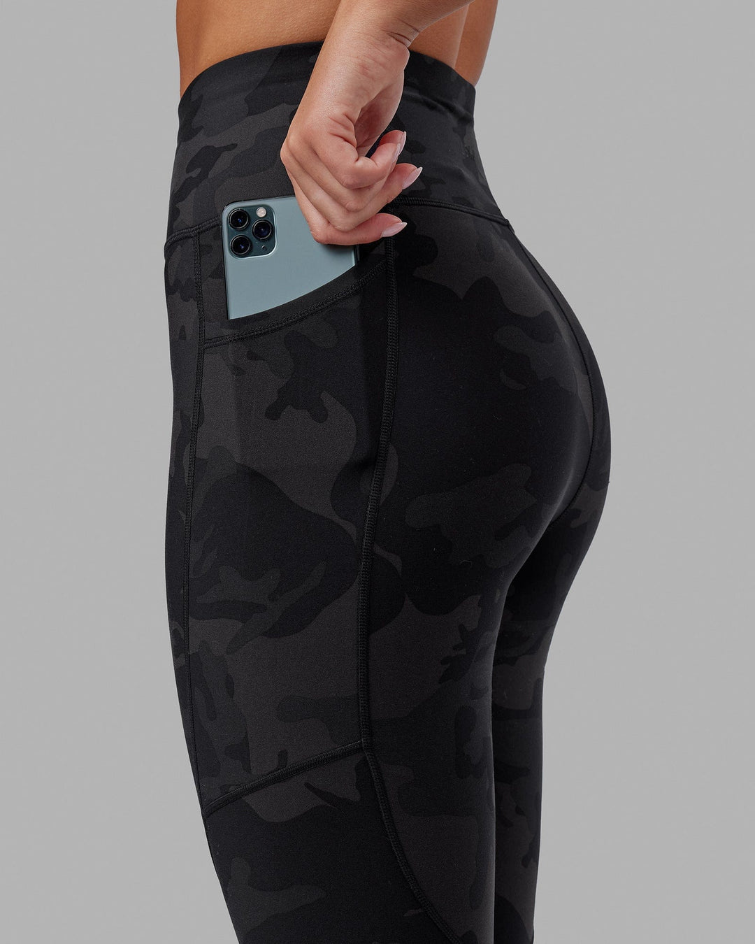 Woman wearing Rep Ultra High-Rise 7/8 Legging Pockets - Black Camo | Model:Milly | Size:S - view 5