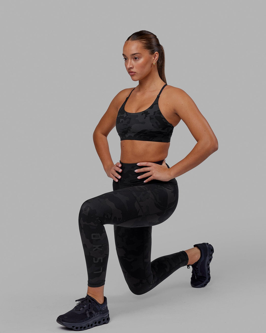 Woman wearing Rep Ultra High-Rise 7/8 Legging Pockets - Black Camo | Model:Milly | Size:S - view 8