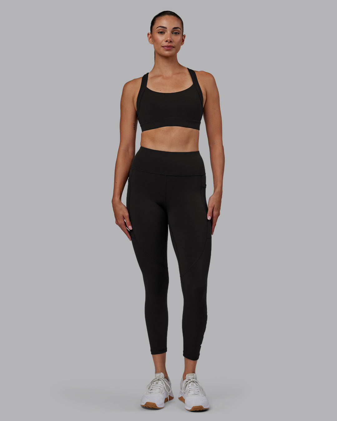 Woman wearing Rep Ultra High-Rise 7/8 Legging Pockets - Pirate Black-White | Model:Blaize | Size:S - view 7