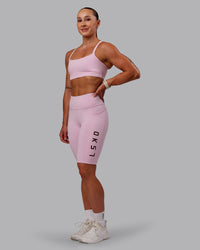 Woman wearing Rep Ultra High-Rise 9" Short Pockets - Marshmallow-Cherry Lacquer | Model:Amber | Size:S | Thumbnail Index: 0