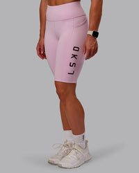 Woman wearing Rep Ultra High-Rise 9" Short Pockets - Marshmallow-Cherry Lacquer | Model:Amber | Size:S | Thumbnail Index: 1