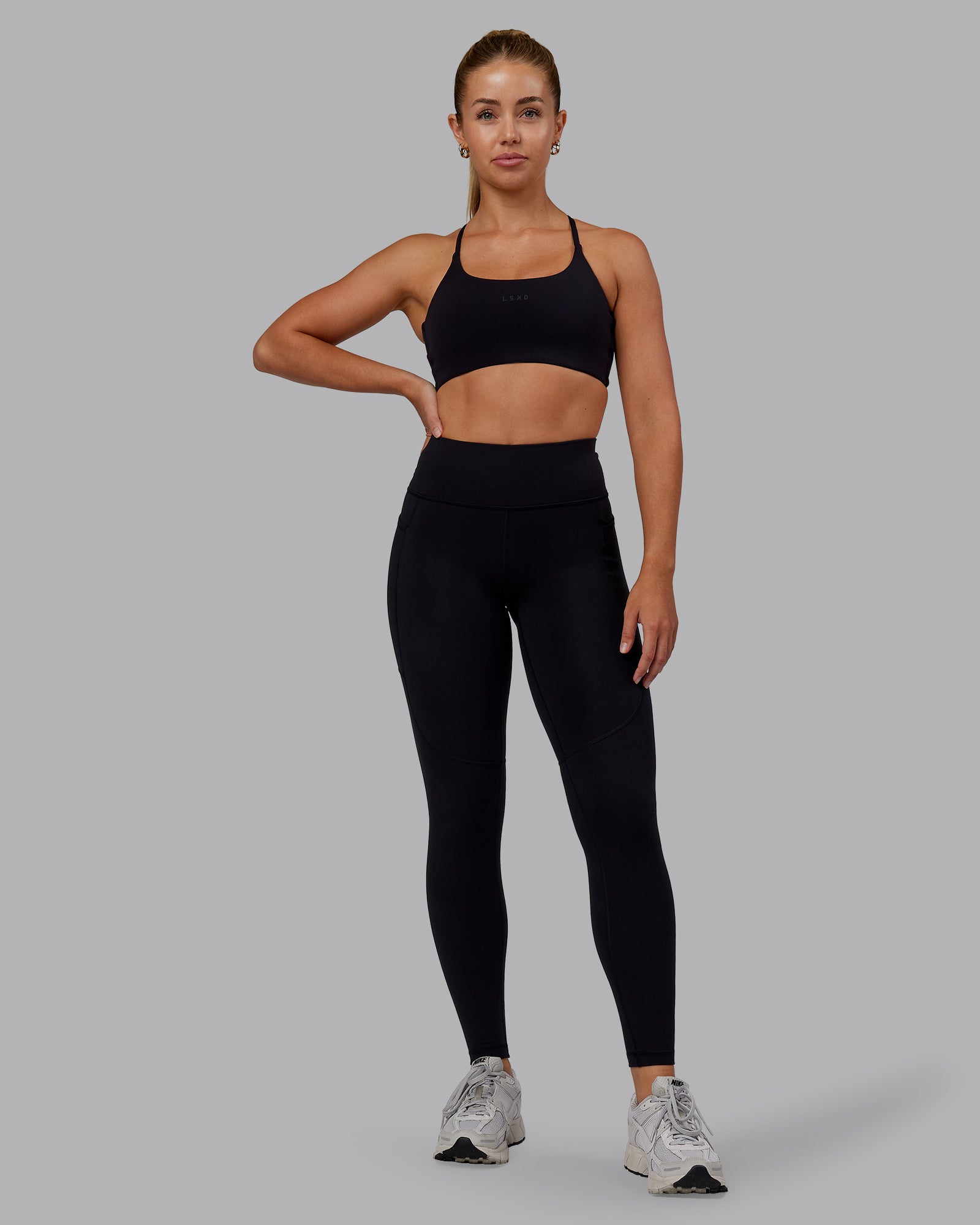 Woman wearing Rep Ultra High-Rise Full Length Legging Pockets - Black-Retro Blue | Model:Hannah | Size:S