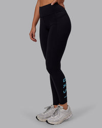Woman wearing Rep Ultra High-Rise Full Length Legging Pockets - Black-Retro Blue | Model:Hannah | Size:S | Thumbnail Index: 0