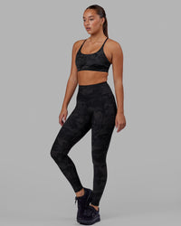 Woman wearing Rep Ultra High-Rise Full Length Legging Pockets - Black Camo | Model:Milly | Size:S | Thumbnail Index: 1