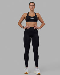 Woman wearing Rep Ultra High-Rise Full Length Legging Pockets - Black-White | Model:Shae | Size:S | Thumbnail Index: 10