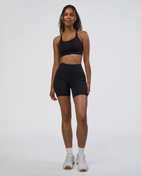 Woman wearing Rep Ultra High-Rise 6" Short Pockets - Black-Black | Model:Jordan | Size:S | Thumbnail Index: 1