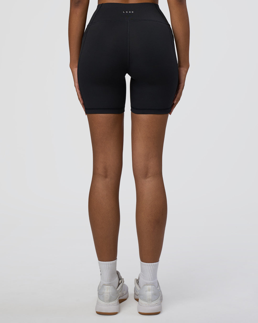 Woman wearing Rep Ultra High-Rise 6" Short Pockets - Black-Black | Model:Jordan | Size:S - view 4