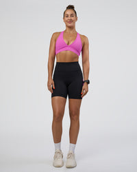 Woman wearing Rep Ultra High-Rise 6" Short Pockets - Black-Ultra Fuchsia | Model:Abbey | Size:S | Thumbnail Index: 1