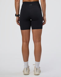 Woman wearing Rep Ultra High-Rise 6" Short Pockets - Black-Ultra Fuchsia | Model:Abbey | Size:S | Thumbnail Index: 3