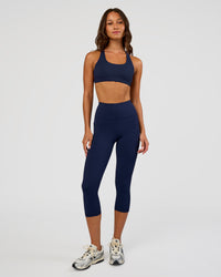 Woman wearing Rep Ultra High-Rise 3/4 Legging Pockets - Future Navy-White | Model:Dakota | Size:S | Thumbnail Index: 5