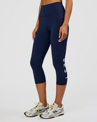 Woman wearing Rep Ultra High-Rise 3/4 Legging Pockets - Future Navy-White | Model:Dakota | Size:S | Thumbnail Index: 4
