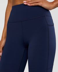 Woman wearing Rep Ultra High-Rise 3/4 Legging Pockets - Future Navy-White | Model:Dakota | Size:S | Thumbnail Index: 7