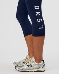 Woman wearing Rep Ultra High-Rise 3/4 Legging Pockets - Future Navy-White | Model:Dakota | Size:S | Thumbnail Index: 6