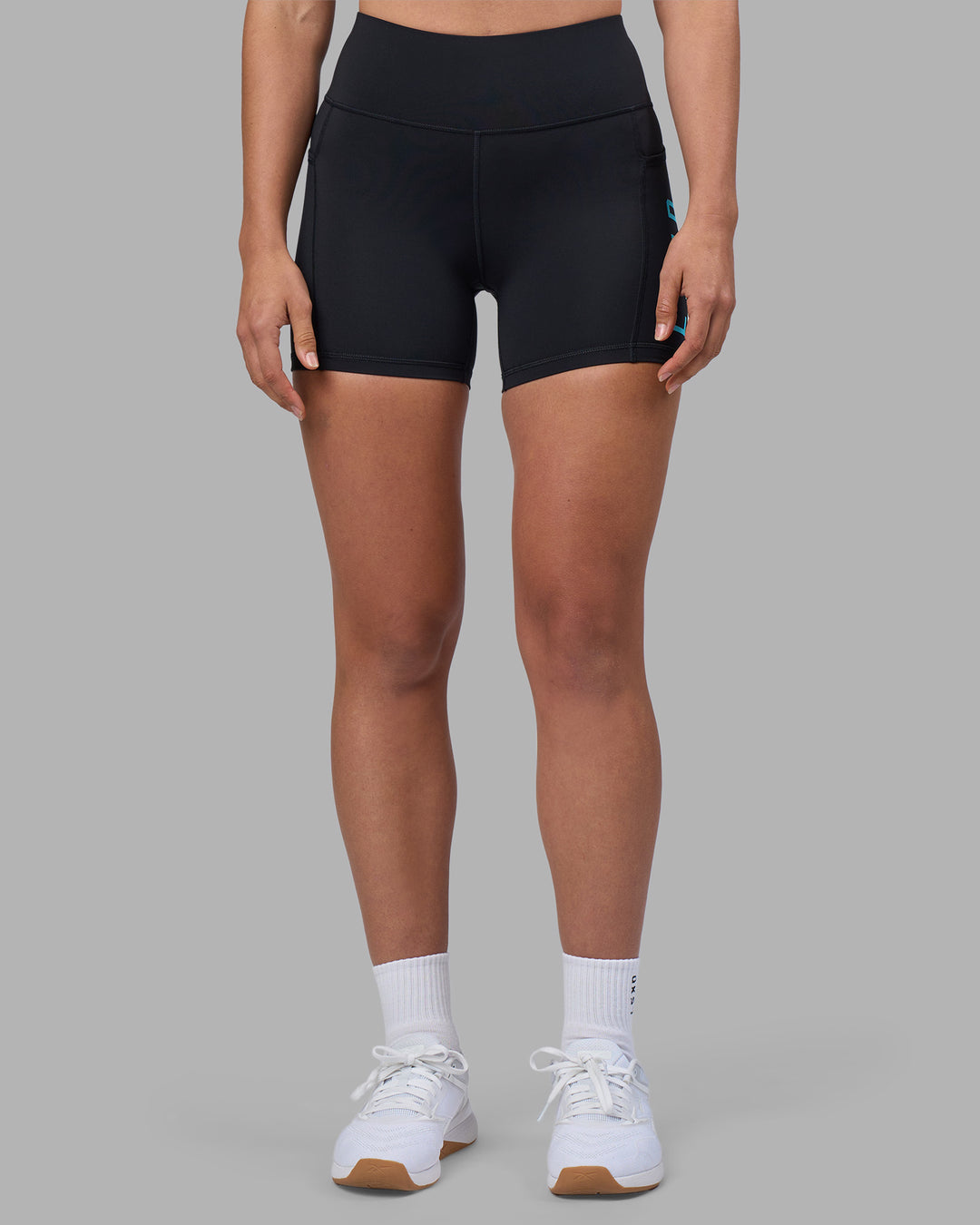 Woman wearing Rep Ultra High-Rise 4" Short Pockets - Black-Blue Atoll | Model:Sophie | Size:S - view 3