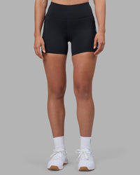 Woman wearing Rep Ultra High-Rise 4" Short Pockets - Black-Blue Atoll | Model:Sophie | Size:S | Thumbnail Index: 2
