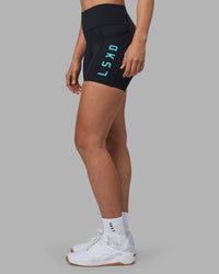 Woman wearing Rep Ultra High-Rise 4" Short Pockets - Black-Blue Atoll | Model:Sophie | Size:S | Thumbnail Index: 6