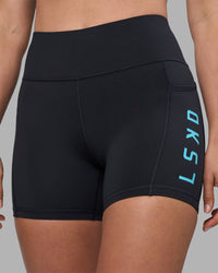 Woman wearing Rep Ultra High-Rise 4" Short Pockets - Black-Blue Atoll | Model:Sophie | Size:S | Thumbnail Index: 5