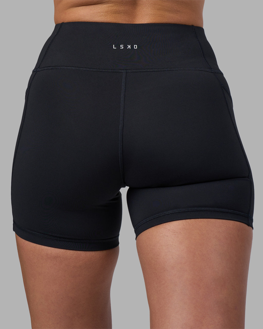 Woman wearing Rep Ultra High-Rise 4" Short Pockets - Black-Blue Atoll | Model:Sophie | Size:S - view 8