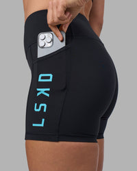 Woman wearing Rep Ultra High-Rise 4" Short Pockets - Black-Blue Atoll | Model:Sophie | Size:S | Thumbnail Index: 0