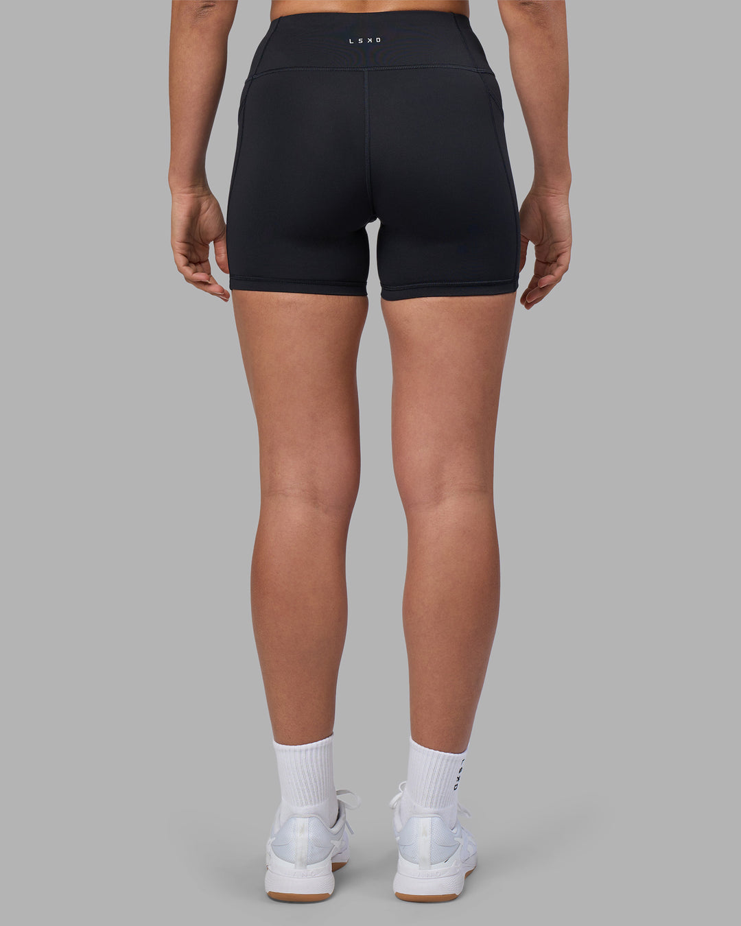 Woman wearing Rep Ultra High-Rise 4" Short Pockets - Black-Blue Atoll | Model:Sophie | Size:S - view 4