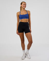 Woman wearing Rep Ultra High-Rise 4" Short Pockets - Black-Electric Indigo | Model:Evie | Size:S | Thumbnail Index: 2